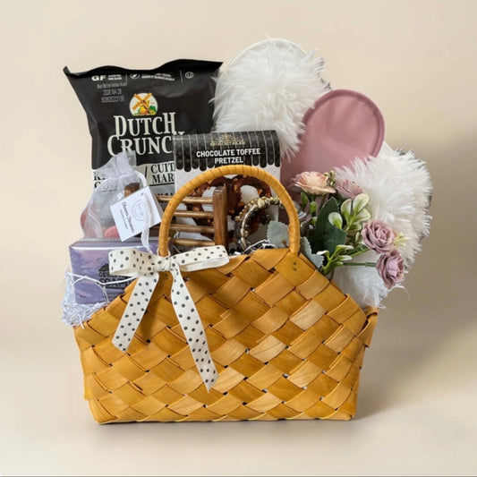 pretty gift basket in wicker handbag slippers spa items and snacks