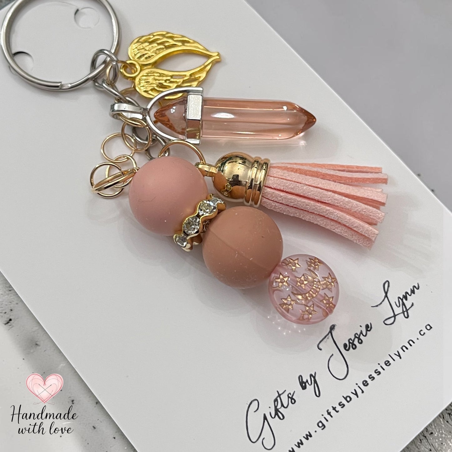 blush color beaded keychain with gold angel wings