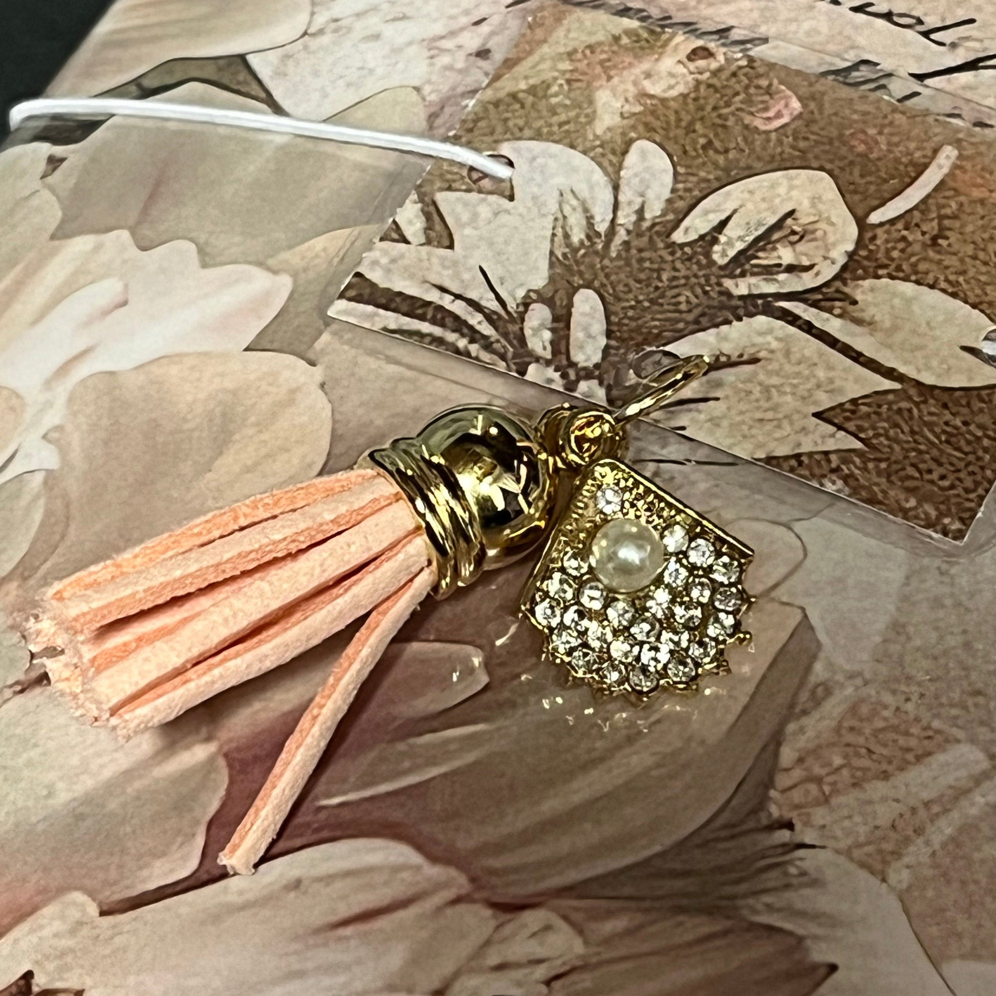 pretty floral design notebook with tassel and charm detail 