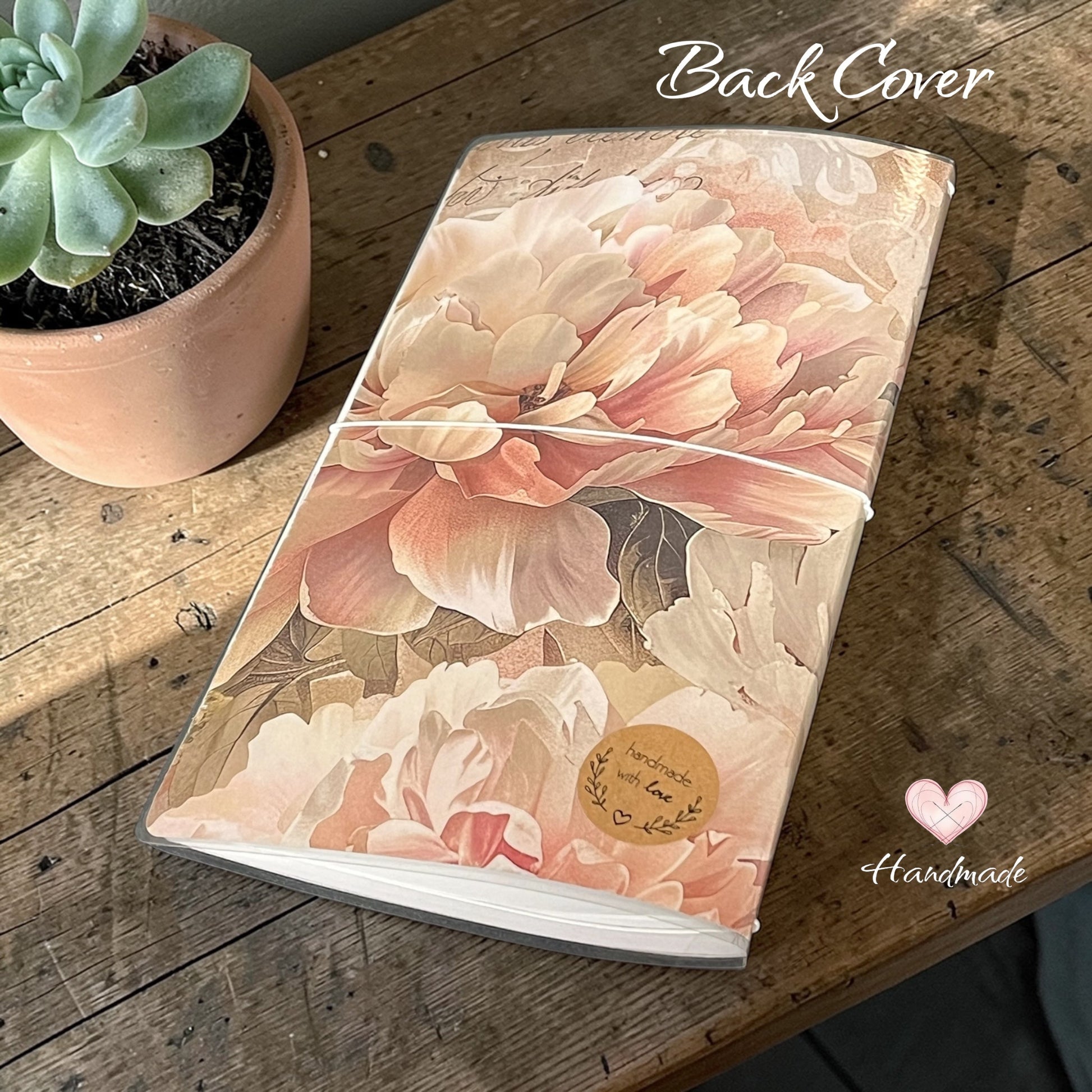 pretty floral design notebook with tassel and charm detail 