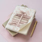 lined notebook A5 size with pink books and bow graphic on cover
