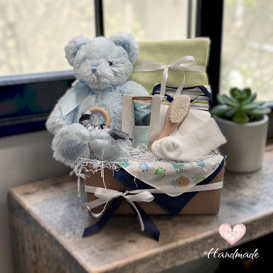 boy baby gift basket with blue teddy bear and green blanket