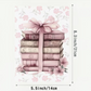lined notebook A5 size with pink books and bow graphic on cover