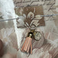 pretty floral design notebook with tassel and charm detail 