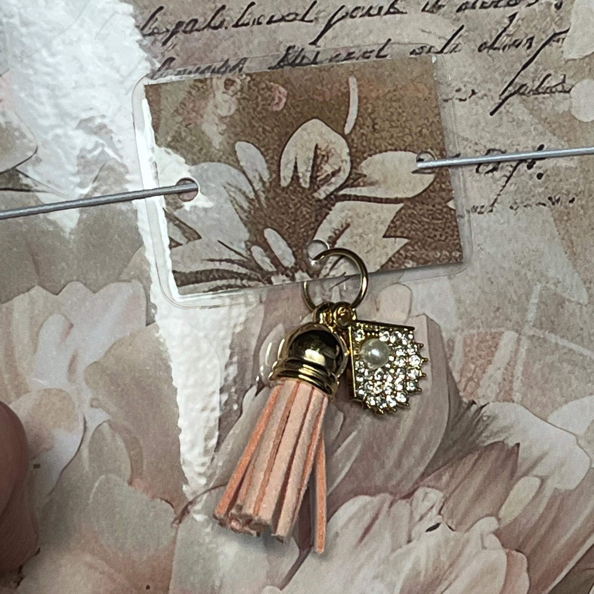 pretty floral design notebook with tassel and charm detail 