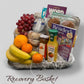 Recovery basket with fruits, snacks, and a magazine on a gray background, local delivery in Windsor Ontario or local pick up
