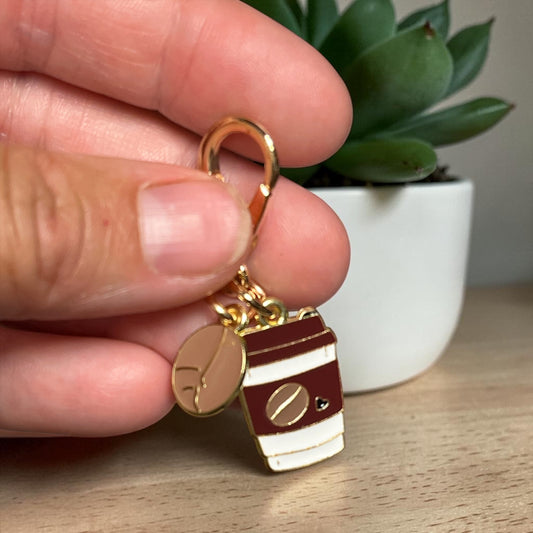 Pocket hug keychain in hands to show size, coffee theme Pocket hug, Pocket hug in Windsor Ontario, coffee cup and coffee bean