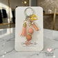 blush color beaded keychain with gold angel wings