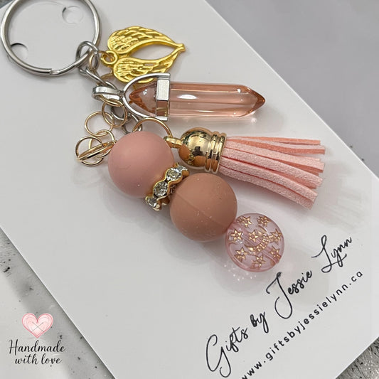 blush color beaded keychain with gold angel wings